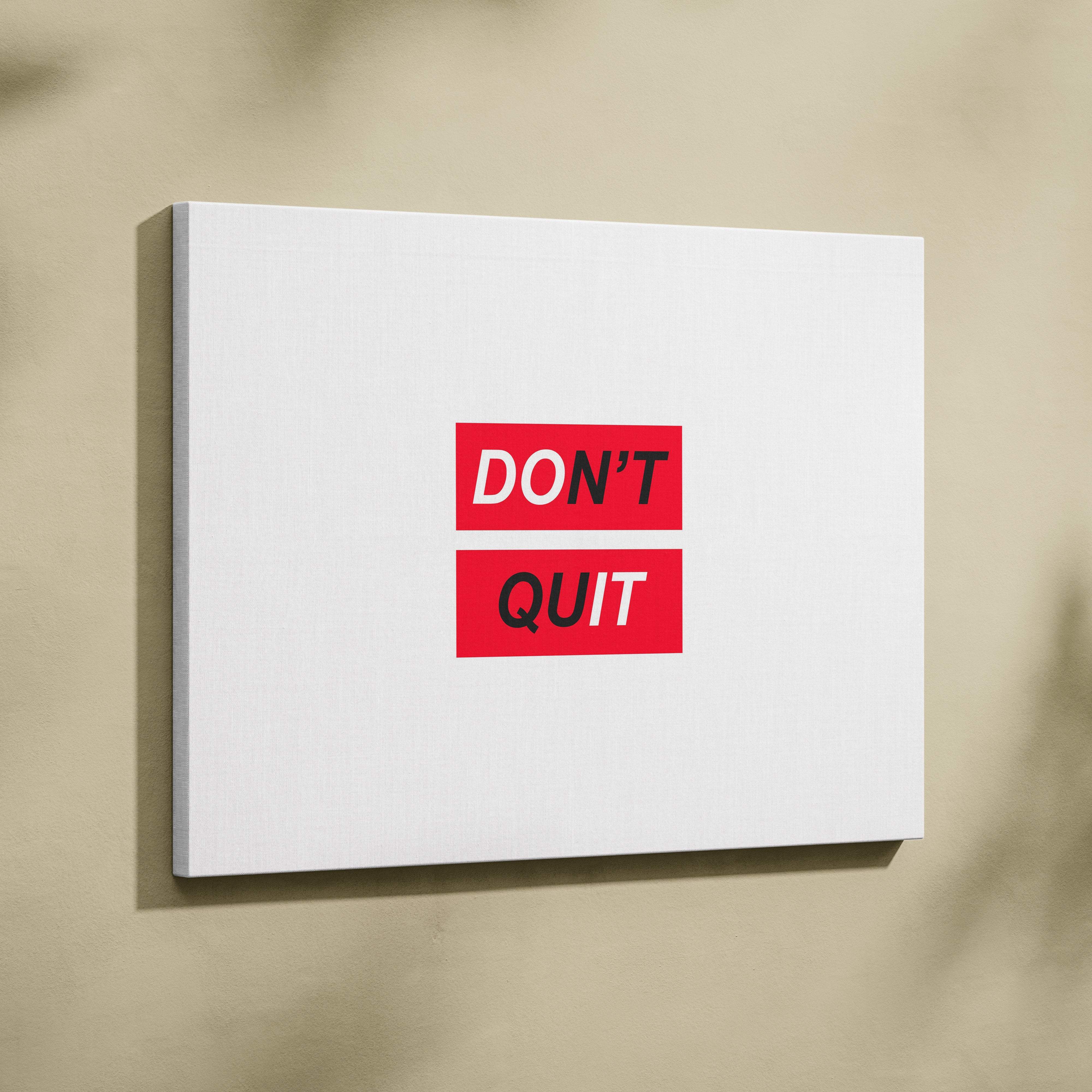 White canvas wall art with dont quit in bold black letters on red blocks minimalist office and home gym decor