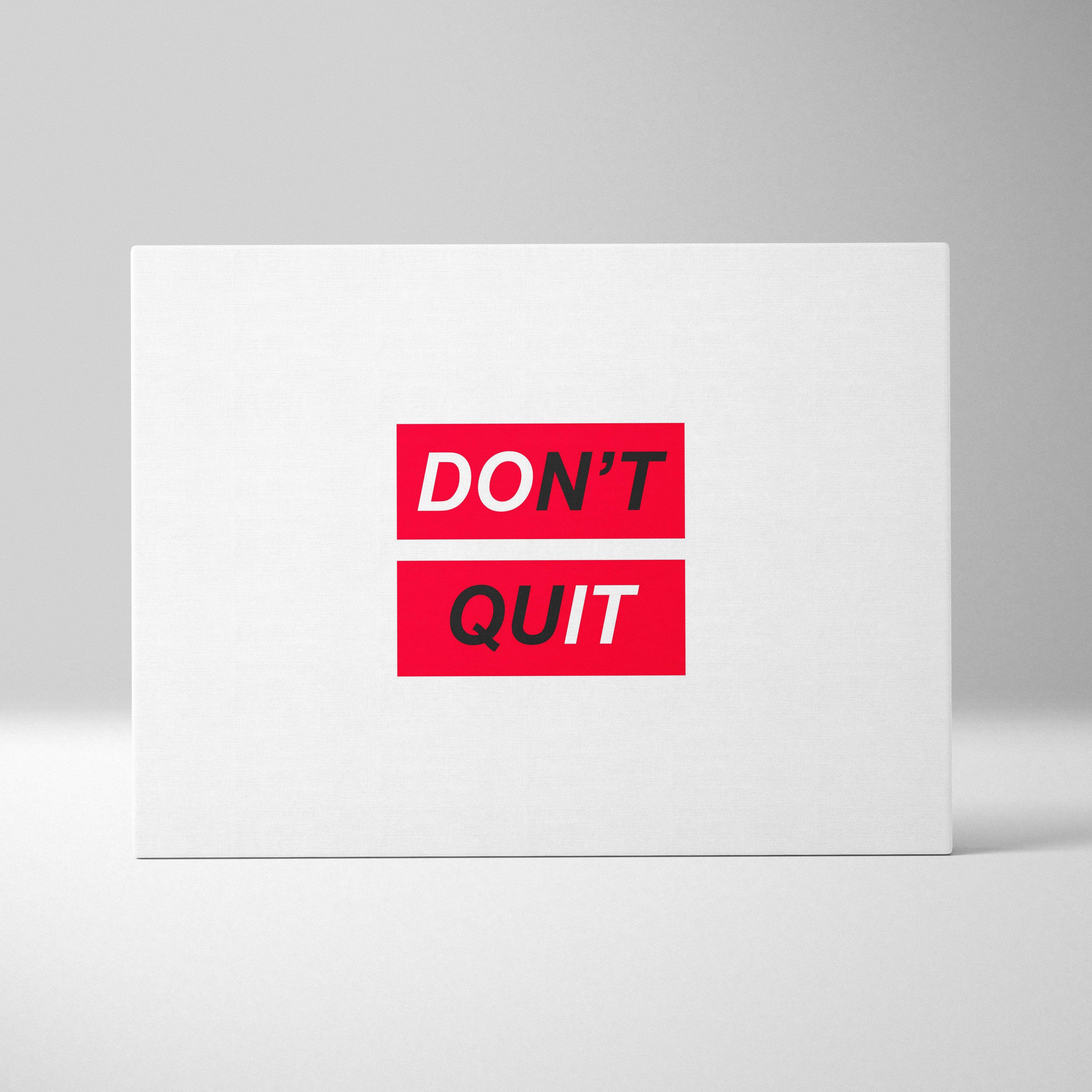 White rectangular canvas wall art with bold red blocks and black motivational don’t quit typography for modern office decor