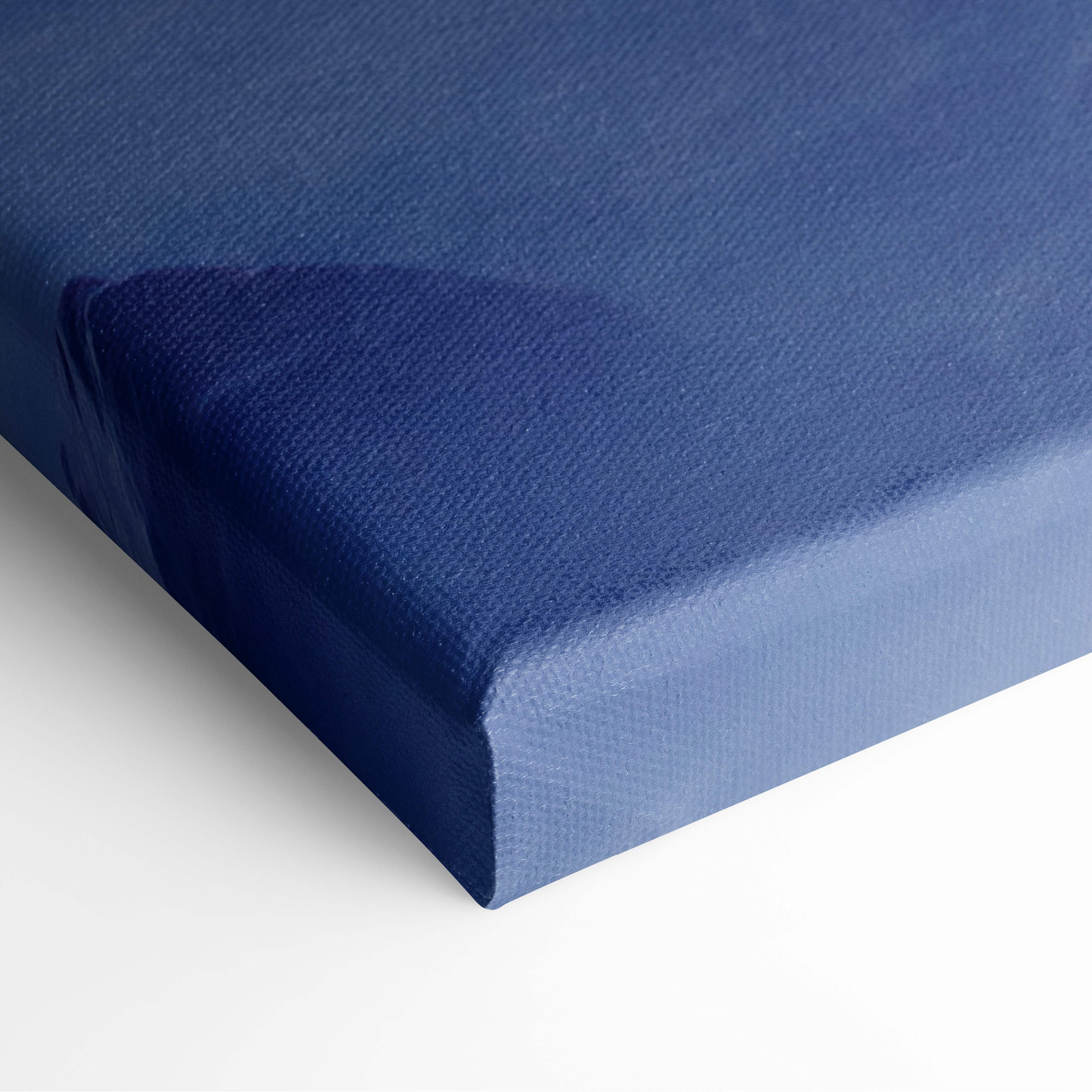 Motivational ocean quote canvas wall art with deep blue textured woven surface and raised edges for coastal decor