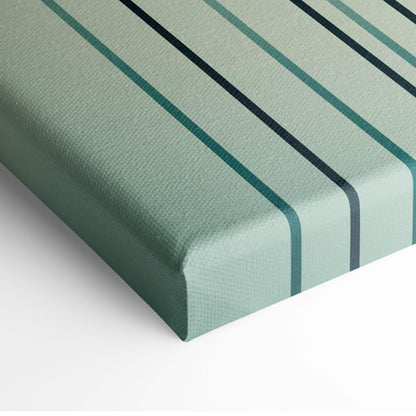 A framed contemporary bamboo sunset canvas wall art with teal and black diagonal stripes on light green fabric background