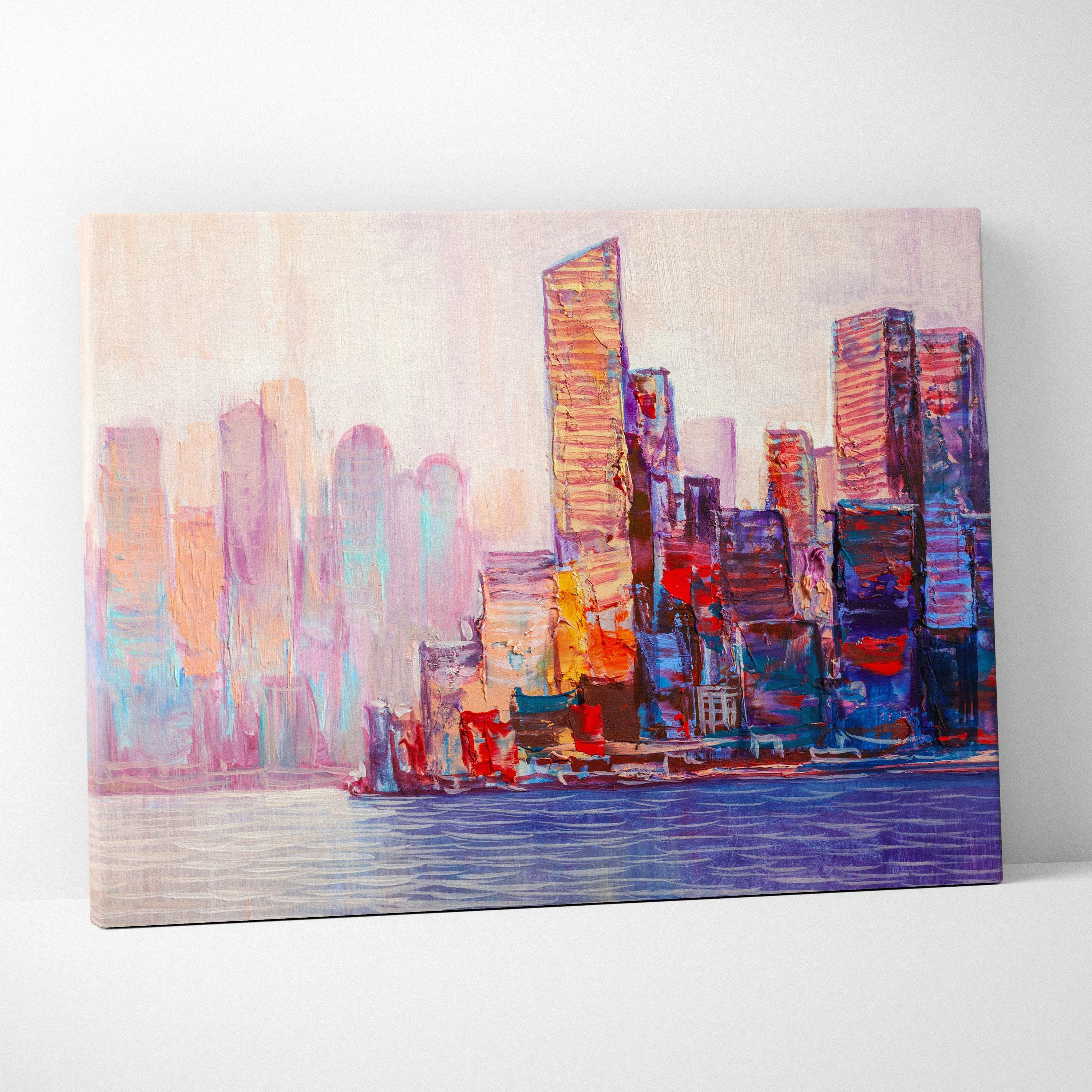 A vibrant abstract cityscape painting on canvas with bold pink purple blue and orange strokes and a soft beige sky