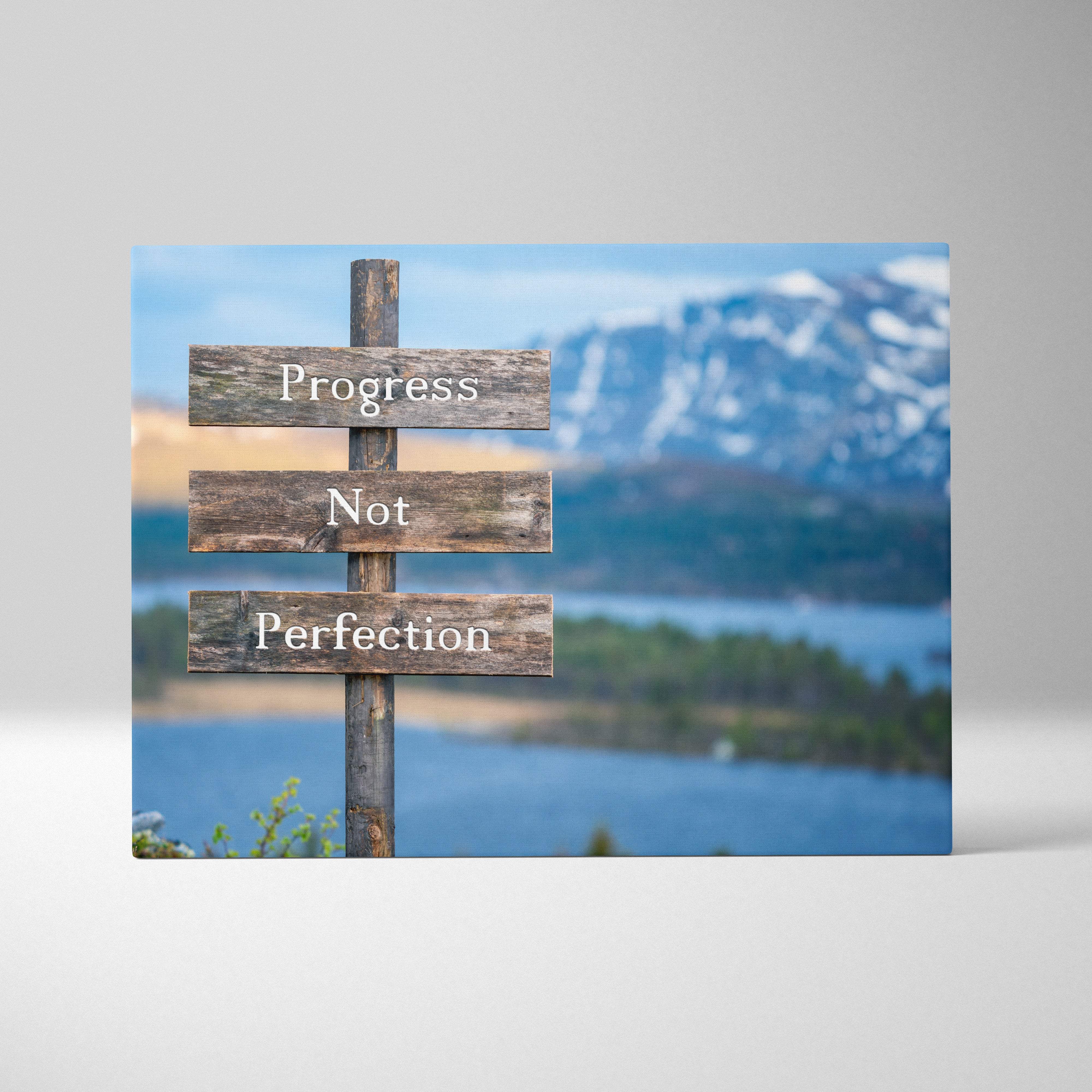 Rustic wooden sign with three weathered planks displaying progress not perfection in white lettering for home or gym decor