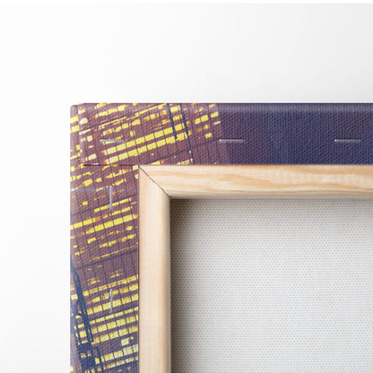 Light-colored wooden frame holding cyberpunk biker canvas wall art with yellow brown cityscape on dark blue background