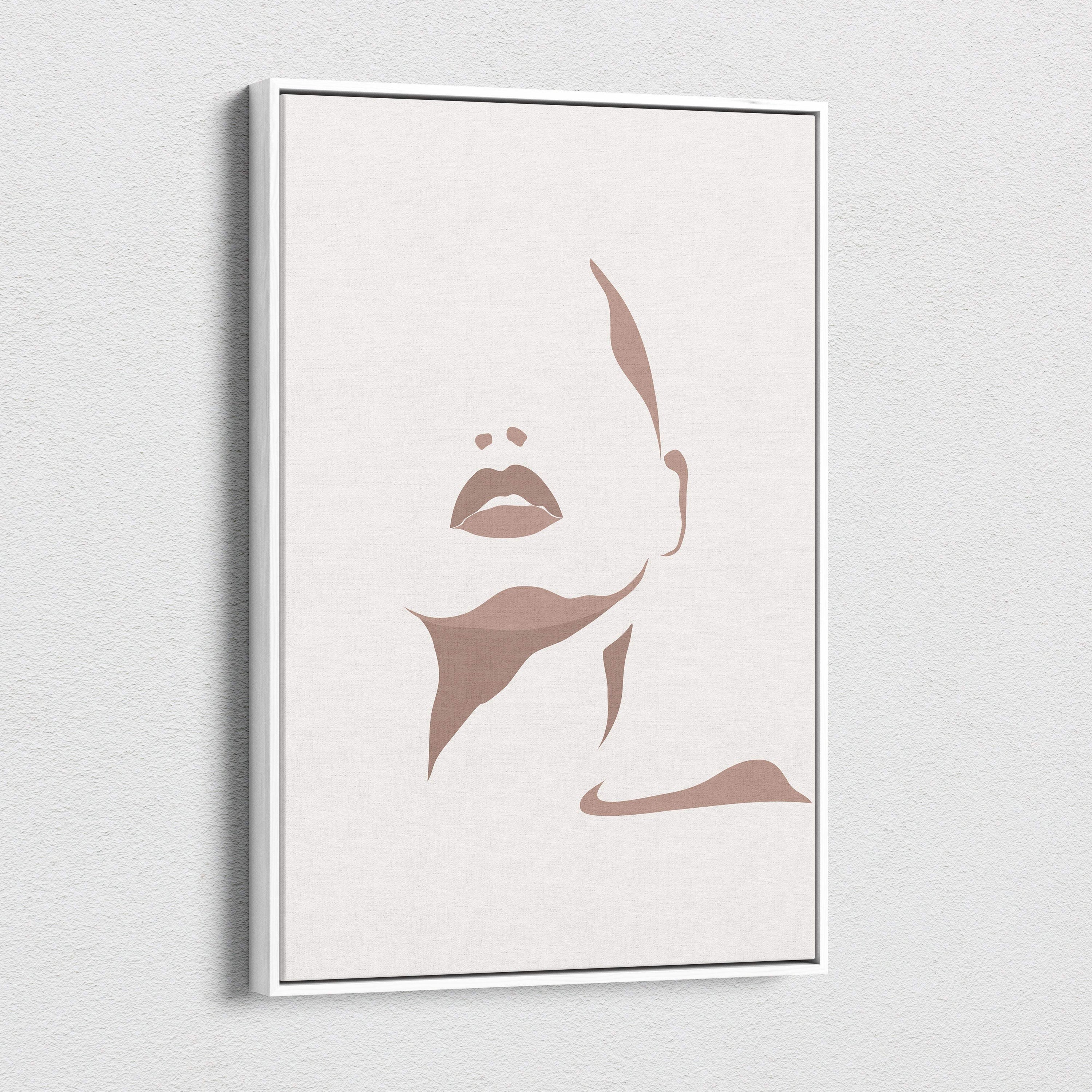 Boho minimalist face canvas wall art with neutral taupe abstract line portrait on beige canvas and white frame