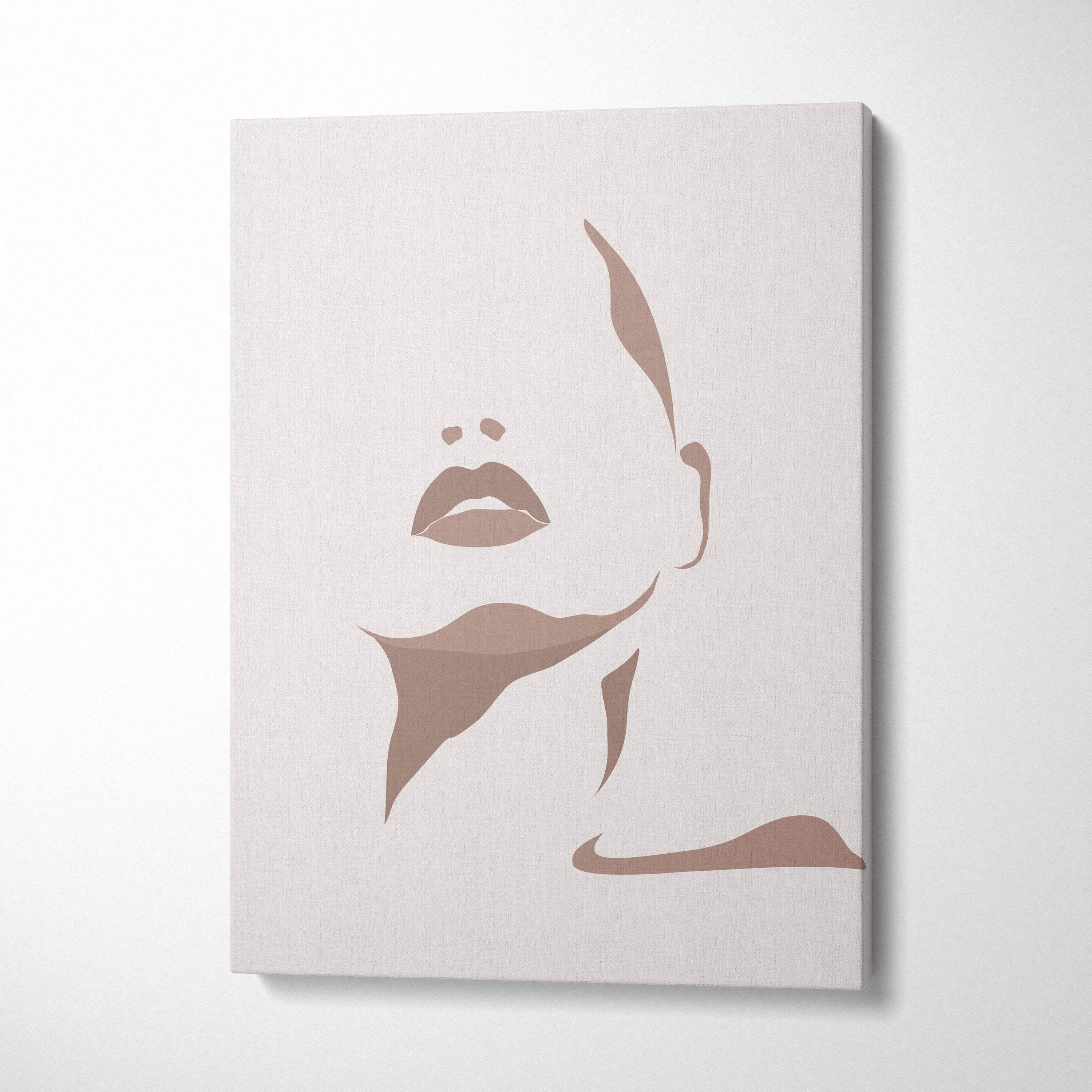 Beige canvas wall art featuring a minimalist silhouette of a woman’s face in neutral taupe tones for boho decor