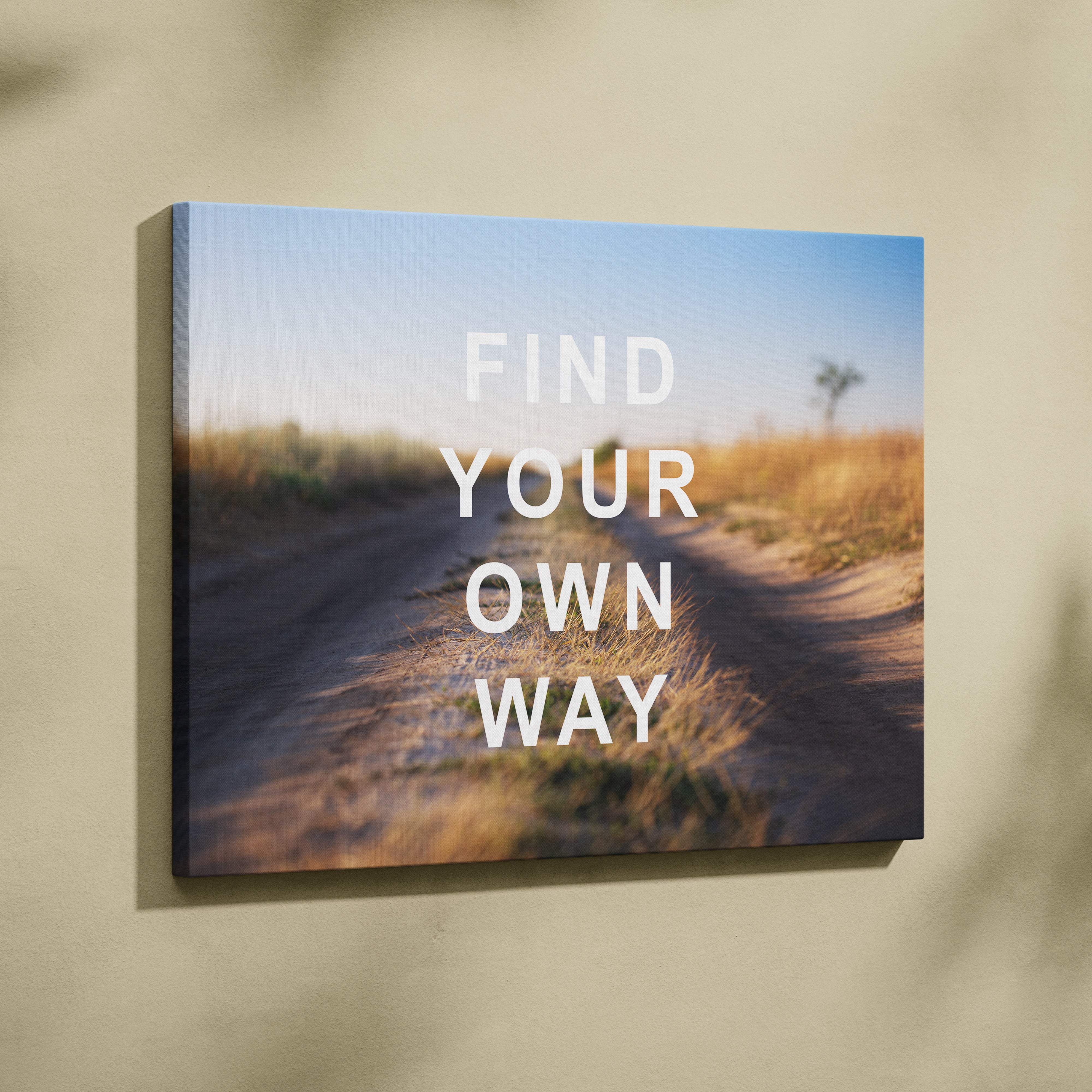 Motivational find your own way rectangular canvas print of a sunlit dirt road with dry grass under blue sky for office or bedroom decor