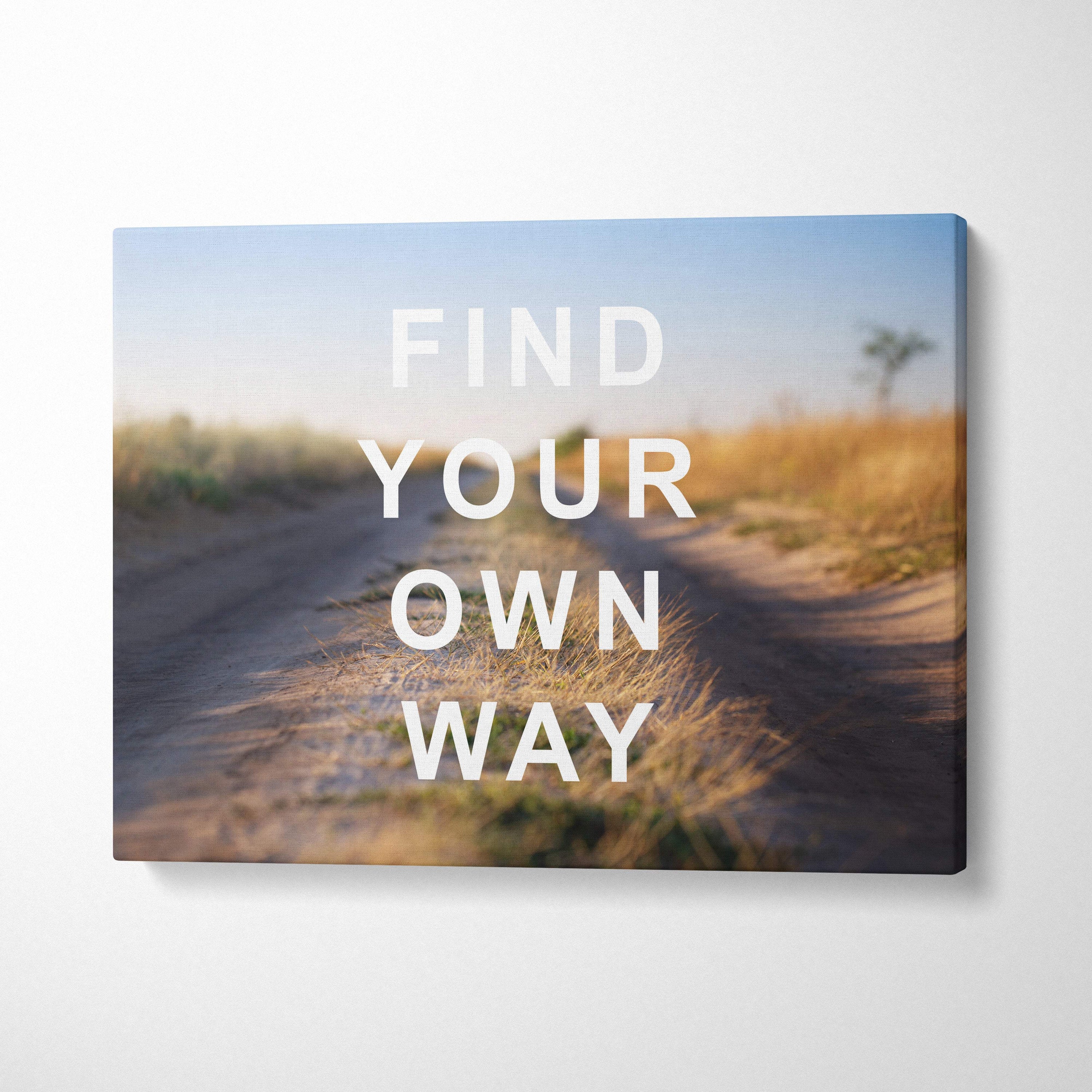 Rectangular canvas print featuring a blurred dirt road through golden grass with motivational text for office or bedroom decor