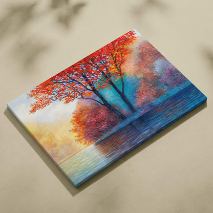 Vibrant autumn trees canvas print featuring fiery red and orange foliage reflected in a serene blue lake landscape