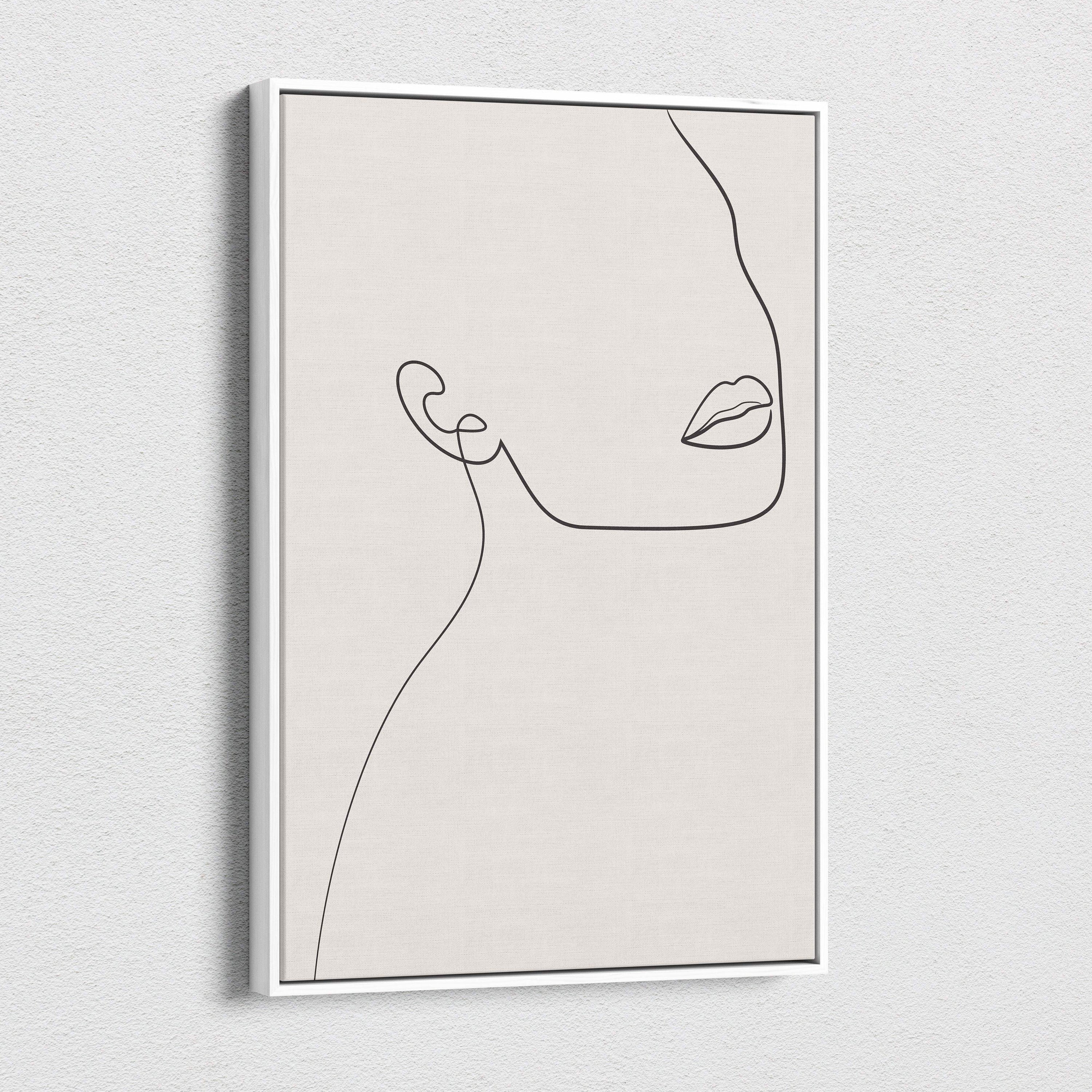 Boho minimalist line art canvas featuring a neutral beige abstract side profile of a woman in a white frame for modern decor