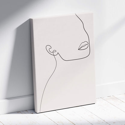 Boho minimalist line art face canvas wall art with delicate black line drawing on neutral beige background for modern decor