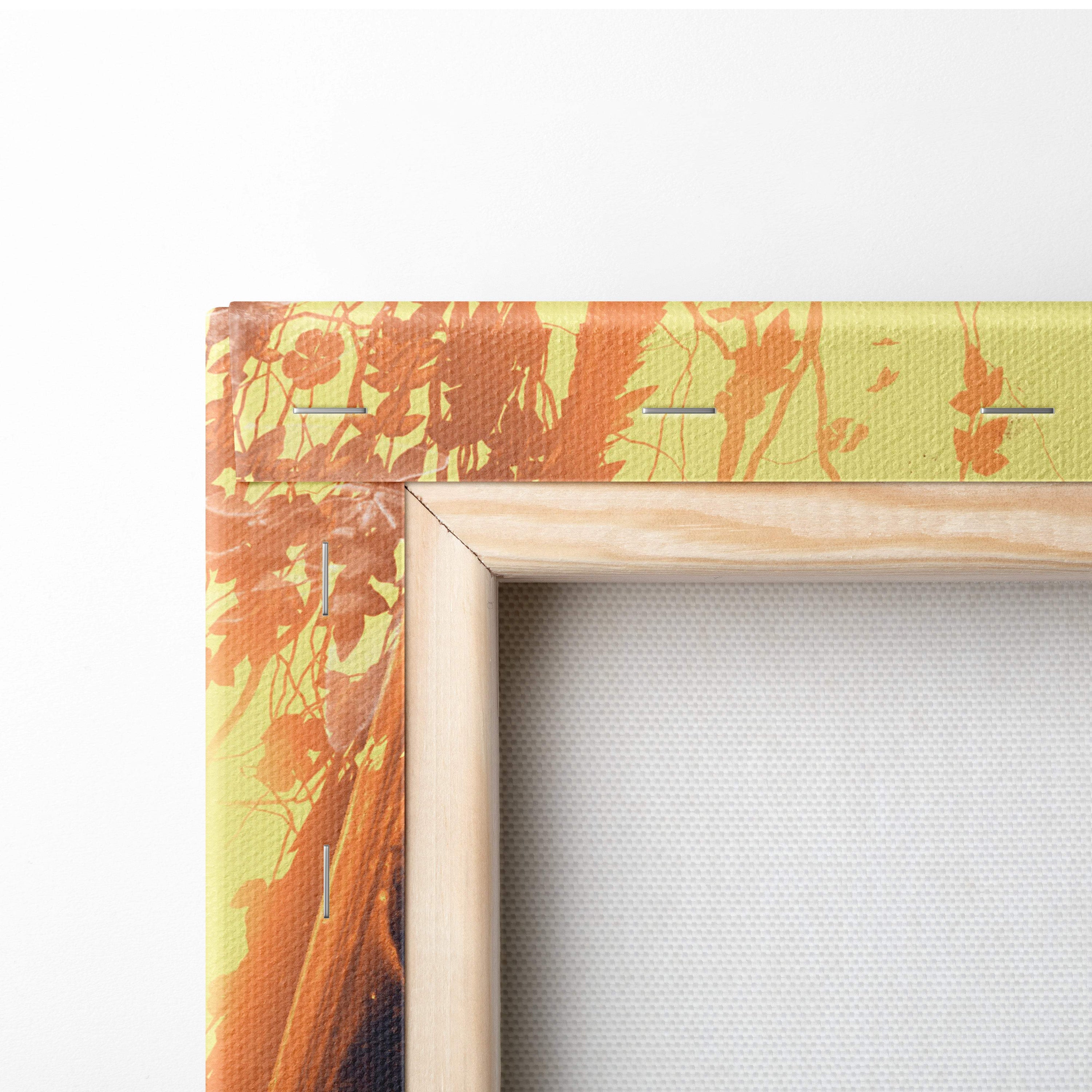 Wooden-framed canvas art featuring vibrant orange and yellow autumn leaf design on textured fabric for wall decor