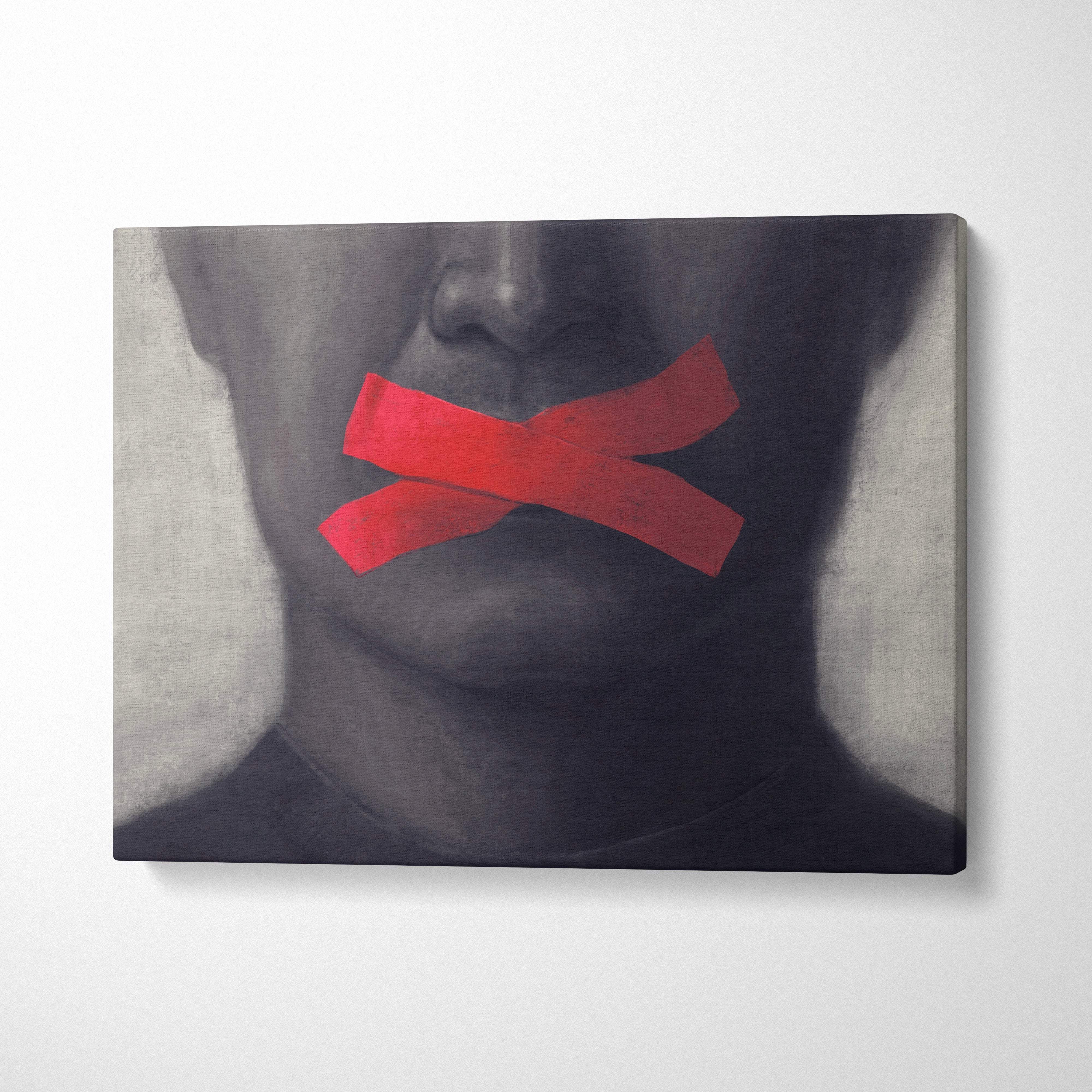 Contemporary silence canvas wall art featuring a grayscale portrait with bright red tape over the mouth for modern decor