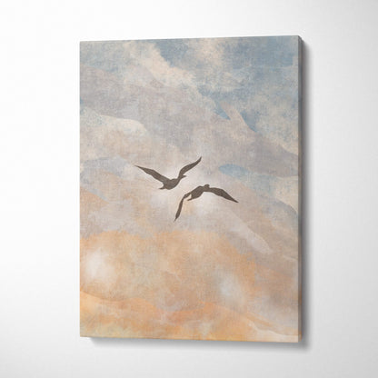 A rectangular boho coastal sky canvas print with two dark silhouetted birds against a soft blue and peach sky
