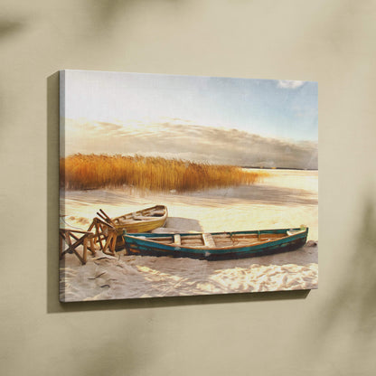 Canvas print of two weathered teal and yellow rowboats on a sandy shore with reeds in a golden winter lakeshore scene
