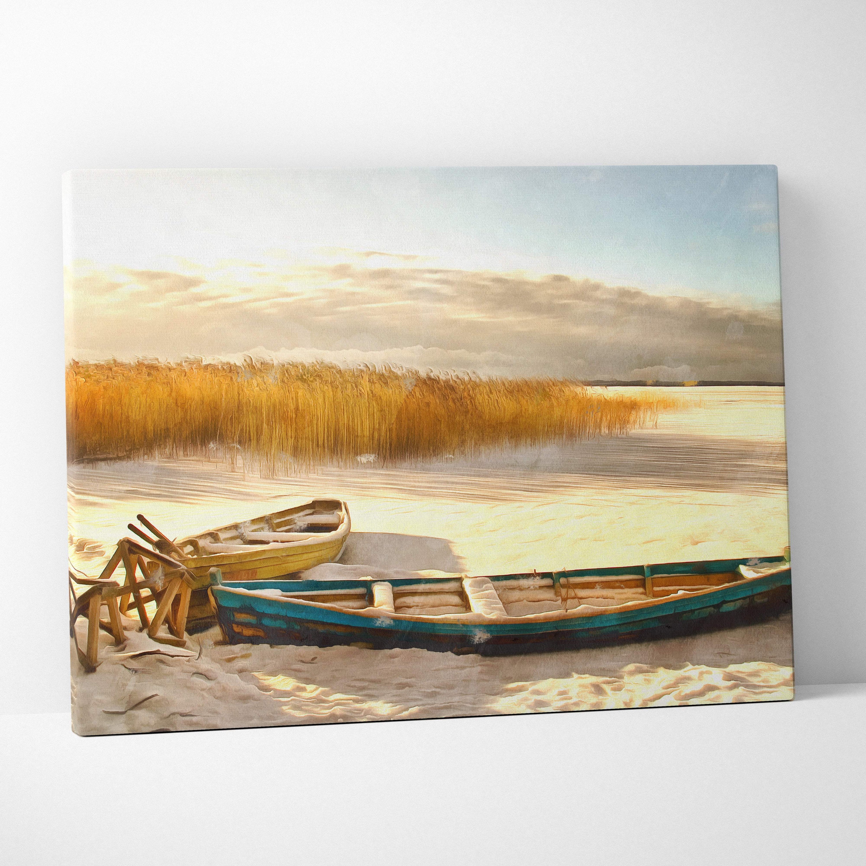 Rectangular canvas print of golden winter lakeshore with weathered yellow and teal rowboats on sandy shore with reeds
