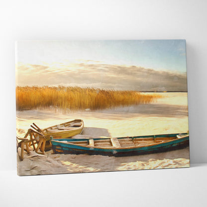 Rectangular canvas print of golden winter lakeshore with weathered yellow and teal rowboats on sandy shore with reeds