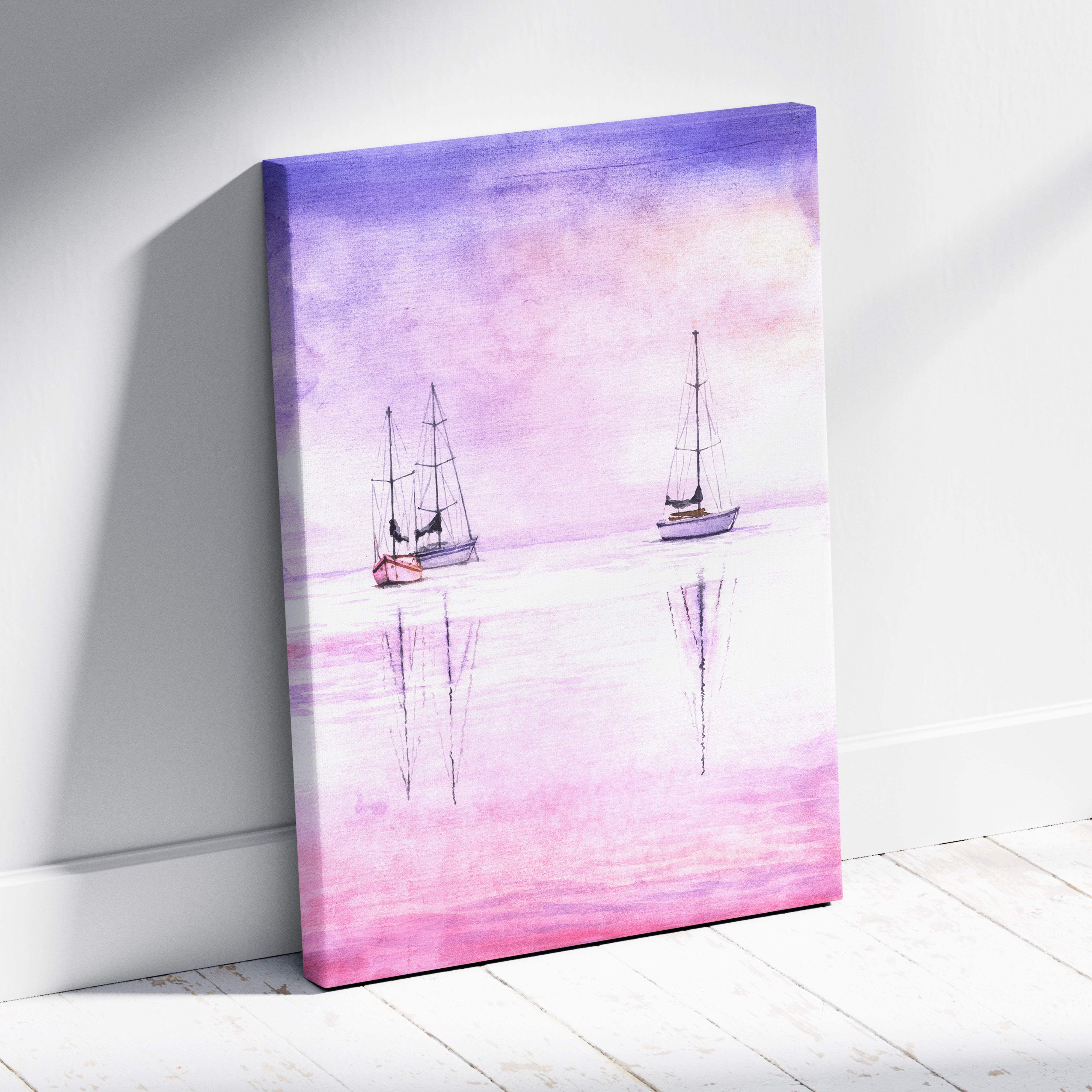 A canvas painting of two sailboats on a soft purple and pink watercolor ocean scene for beach house decor