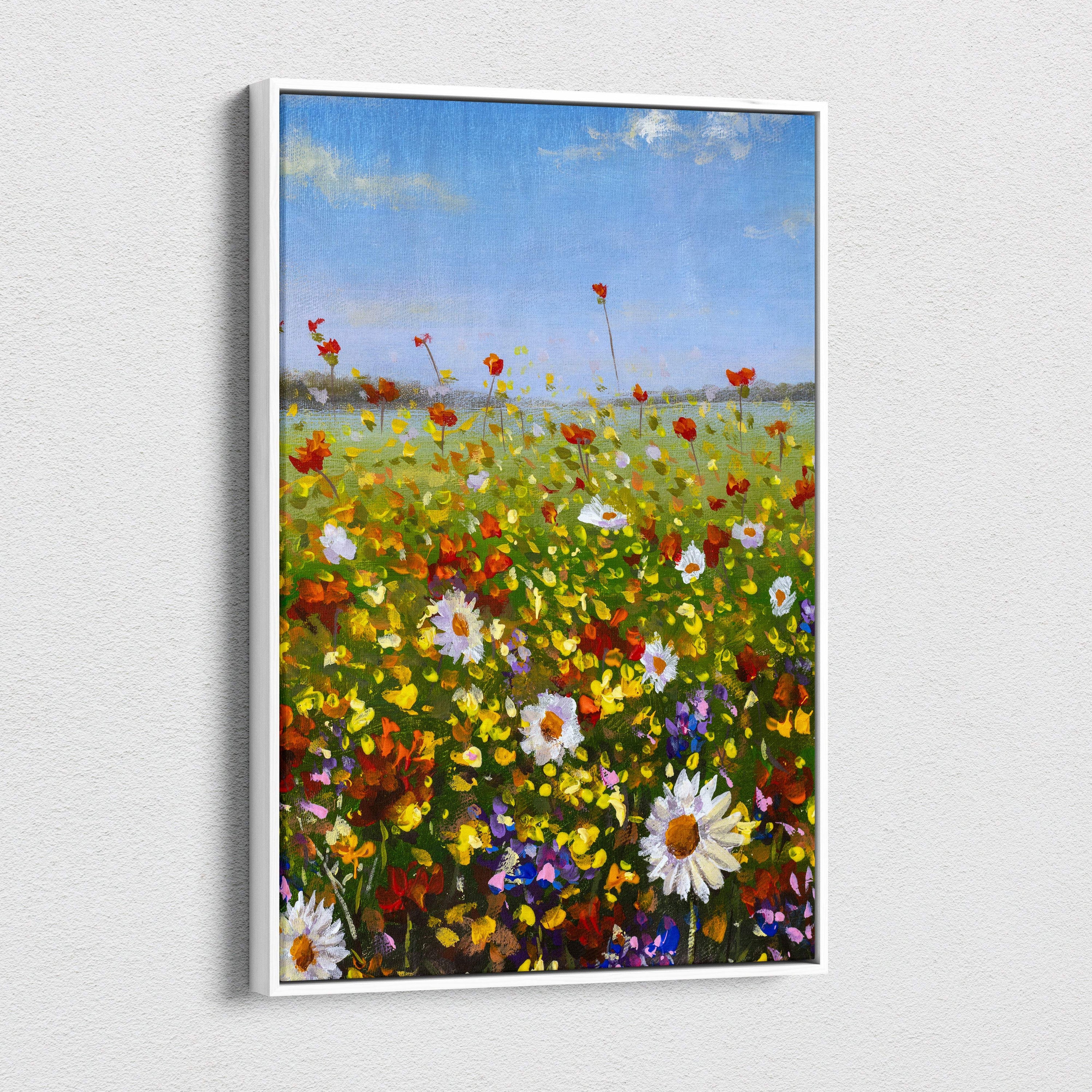 A vibrant wildflower meadow landscape canvas print with red poppies white daisies and blue sky in a sleek white frame