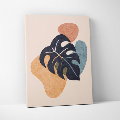 A modern abstract canvas print with bold black monstera leaf on beige terracotta and muted blue shapes wall art