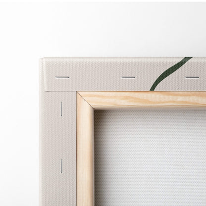 Light wood framed canvas with subtle green leaf design on off white fabric for minimalist boho desert wall art