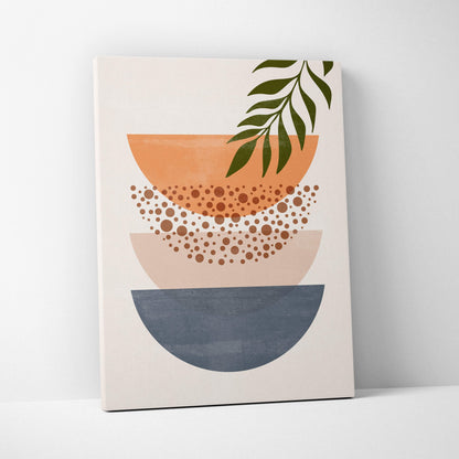 Modern abstract canvas print of stacked semi circular bowls in terracotta blush pink and slate gray with green leaf accent