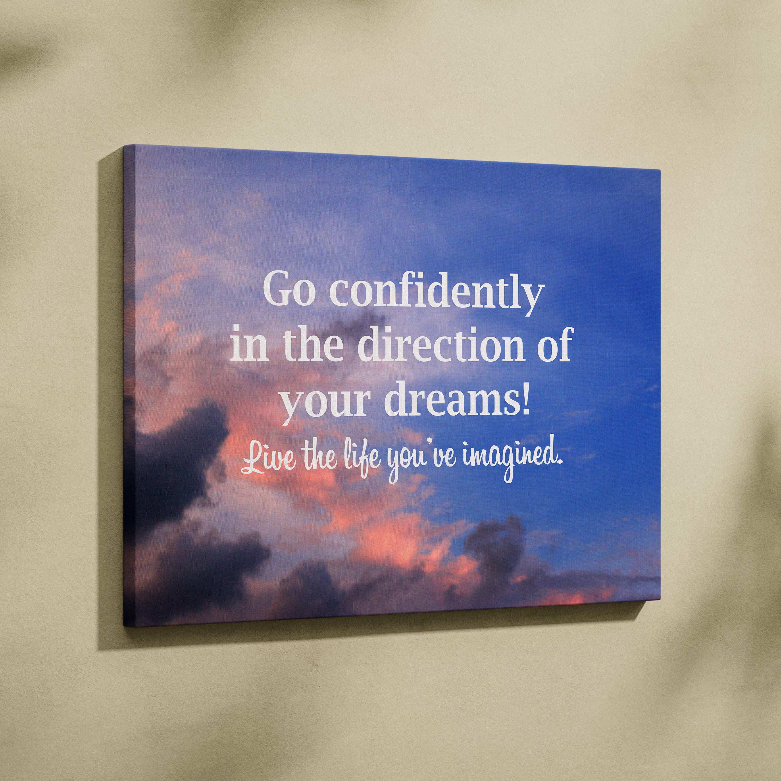 Inspirational dream big canvas wall art with vibrant pink and purple sunset sky and motivational white text for bedroom or office