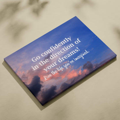 Blue canvas print with sunset sky and inspirational go confidently in the direction of your dreams quote for decor