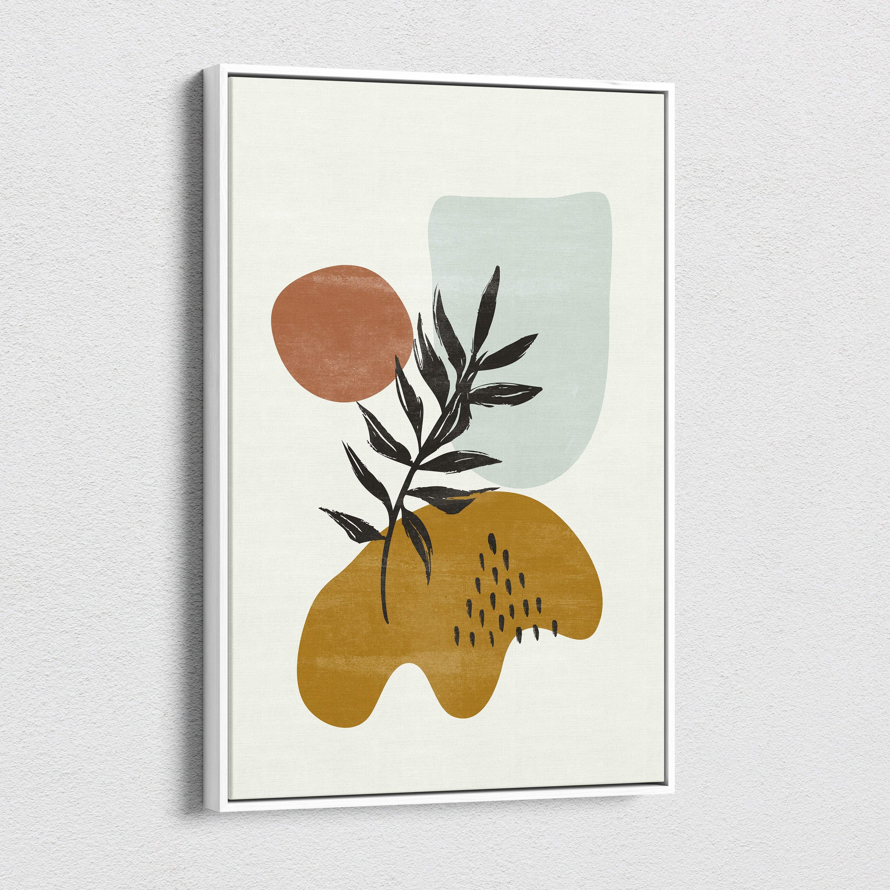 Abstract botanical wall art with a minimalist black leaf branch and earth tone shapes in terracotta mustard and sage green