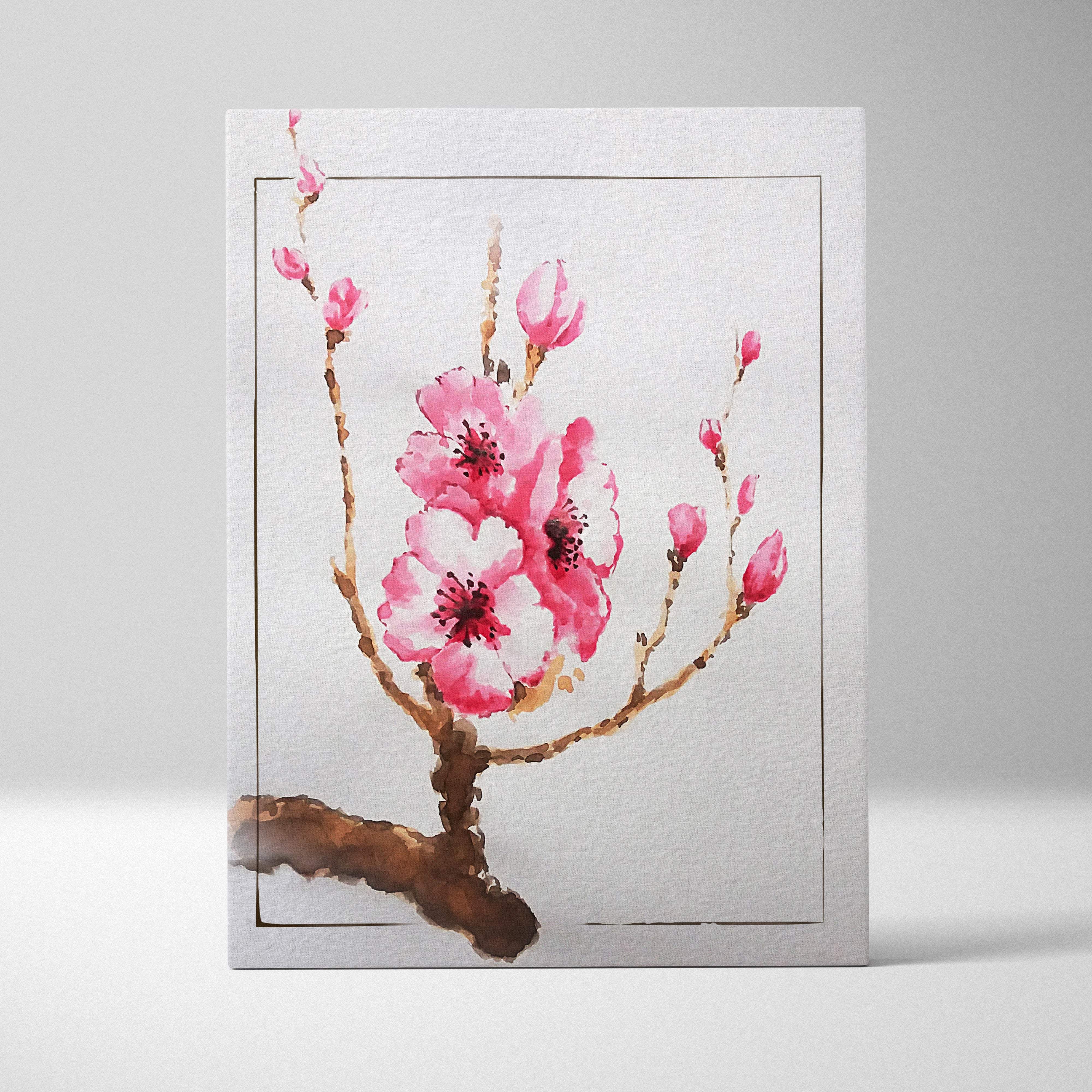 A delicate pink cherry blossom canvas wall art with watercolor painting style in a simple silver frame for soft zen decor
