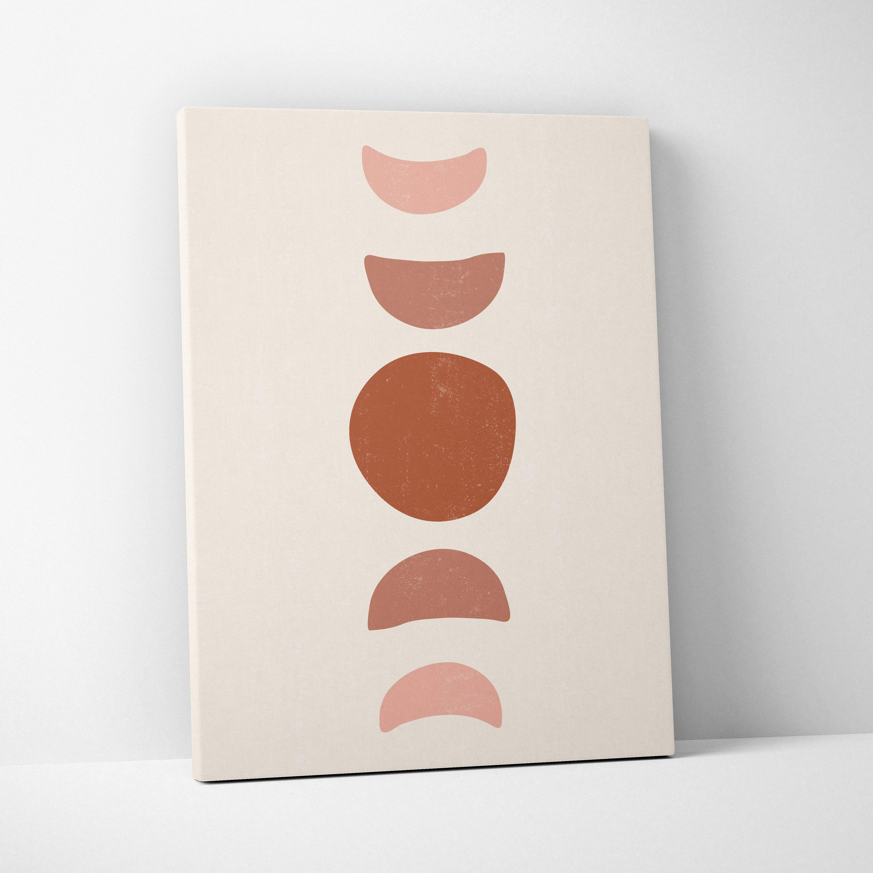 Minimalist geometric balance wall art featuring five terracotta and blush pink moon phases on a cream canvas print
