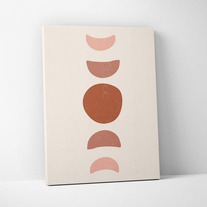Minimalist geometric balance wall art featuring five terracotta and blush pink moon phases on a cream canvas print