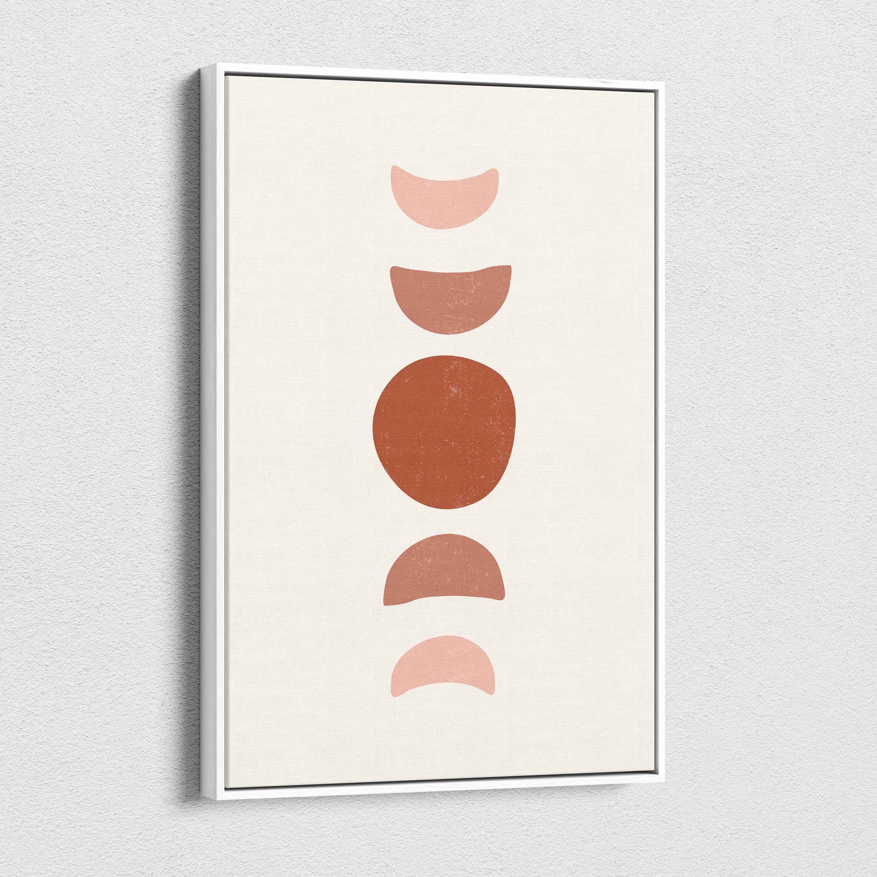 Minimalist framed wall art print with earthy terracotta and blush moon phases on a cream background for boho decor