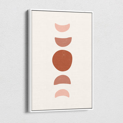 Minimalist framed wall art print with earthy terracotta and blush moon phases on a cream background for boho decor