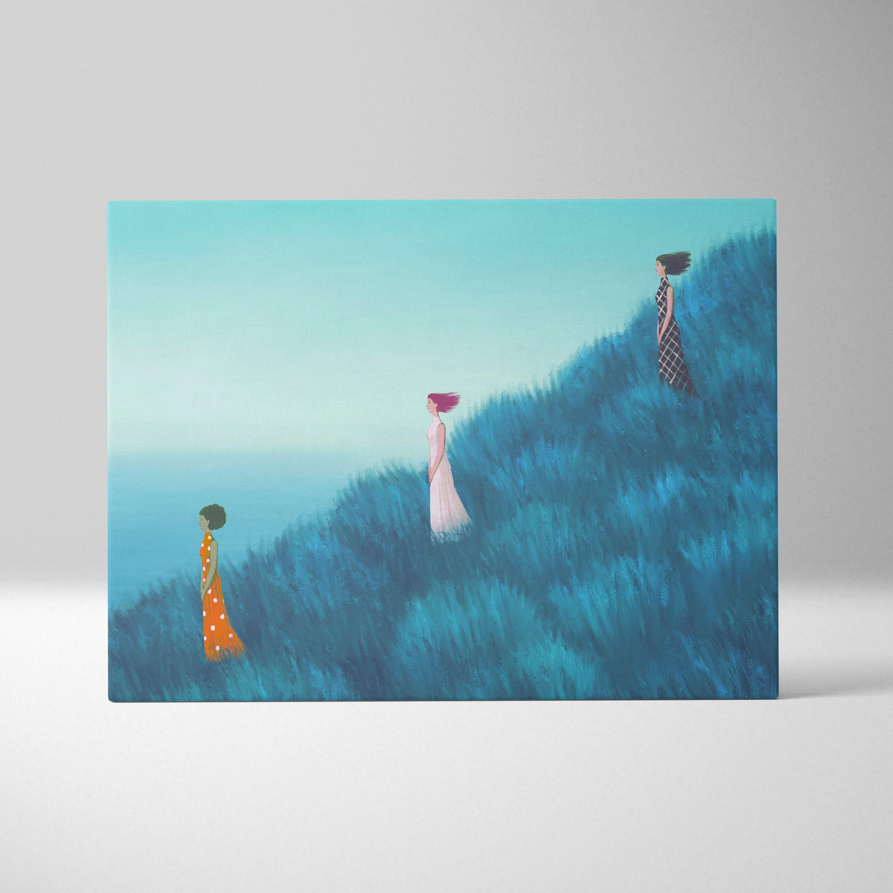 Contemporary women in blue field canvas wall art with three stylized women in flowing dresses on a blue hillside