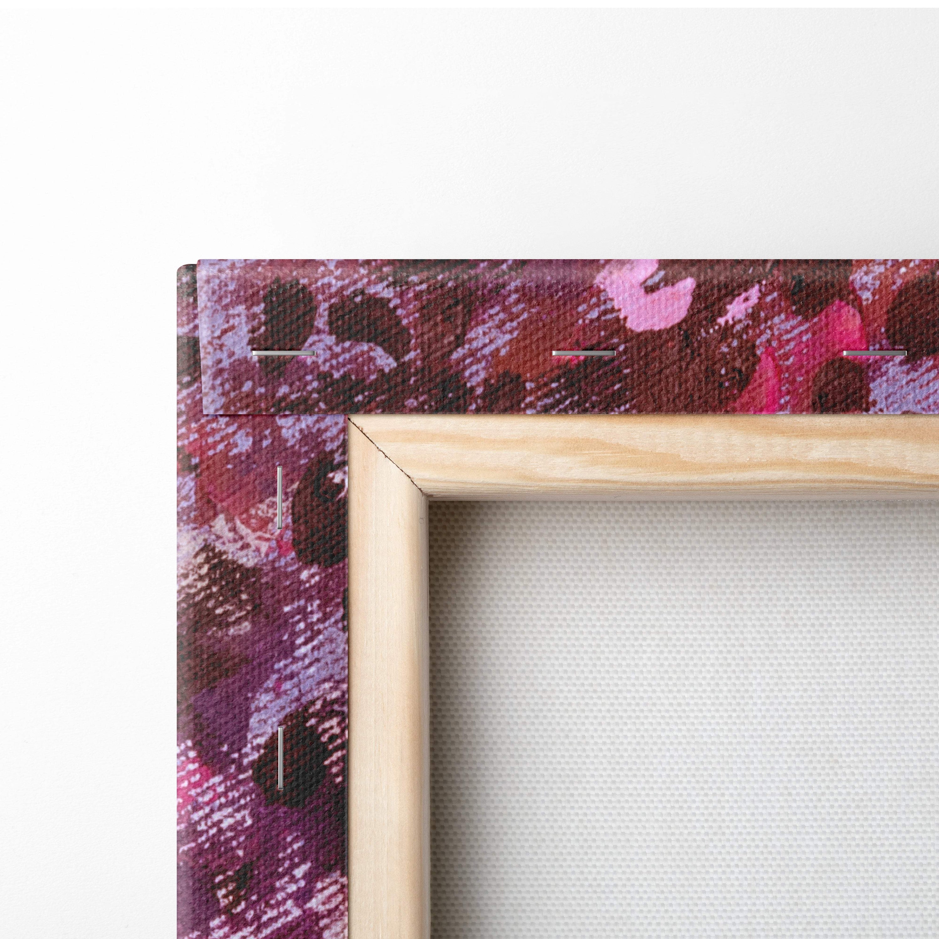 A wooden-framed canvas print with vibrant pink purple and deep red abstract design for wall art decoration