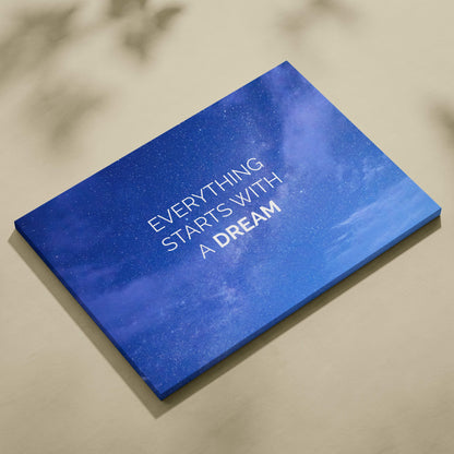 Blue canvas print featuring starry night sky with motivational everything starts with a dream text for home decor
