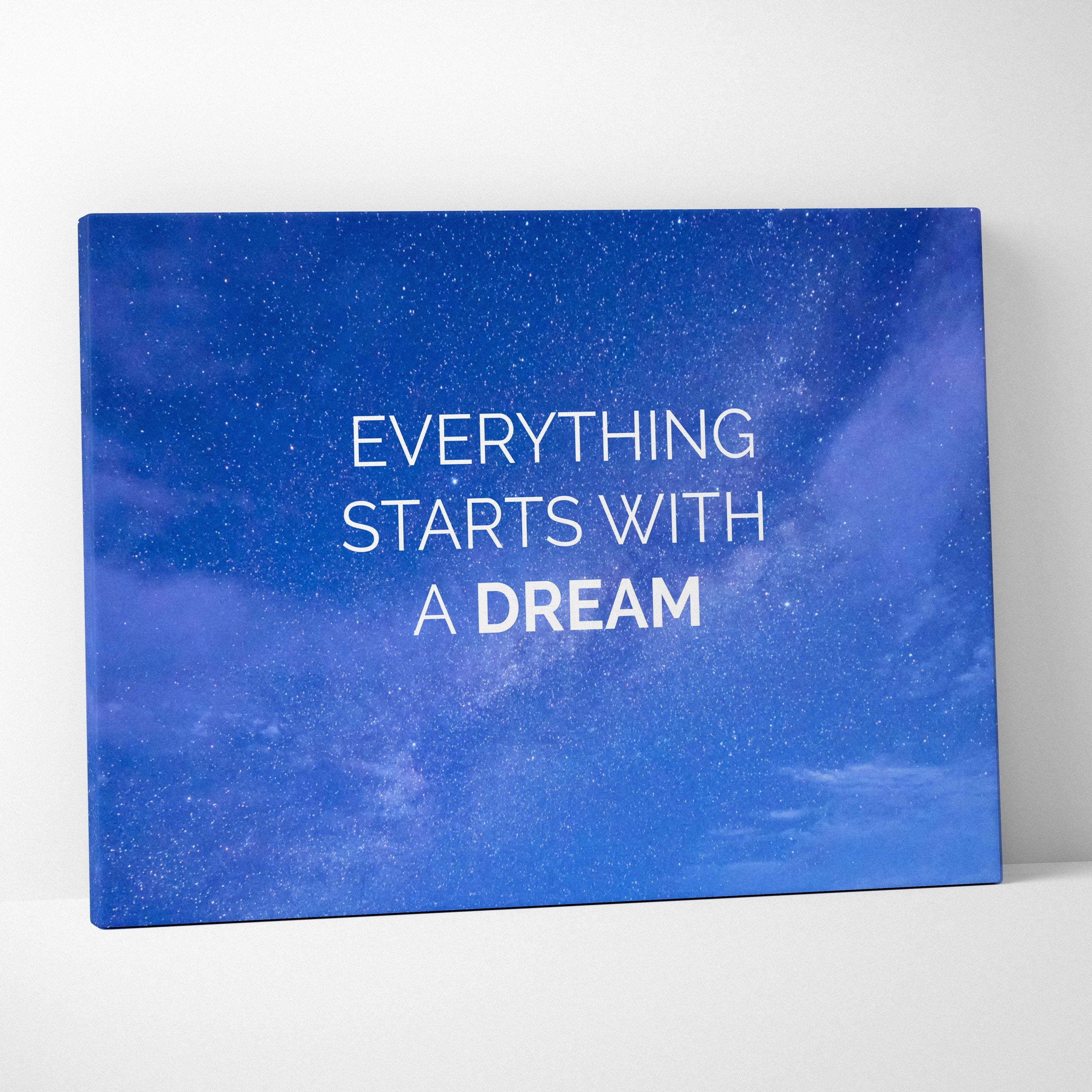 Blue canvas print featuring everything starts with a dream phrase in white on a starry night sky for motivational decor