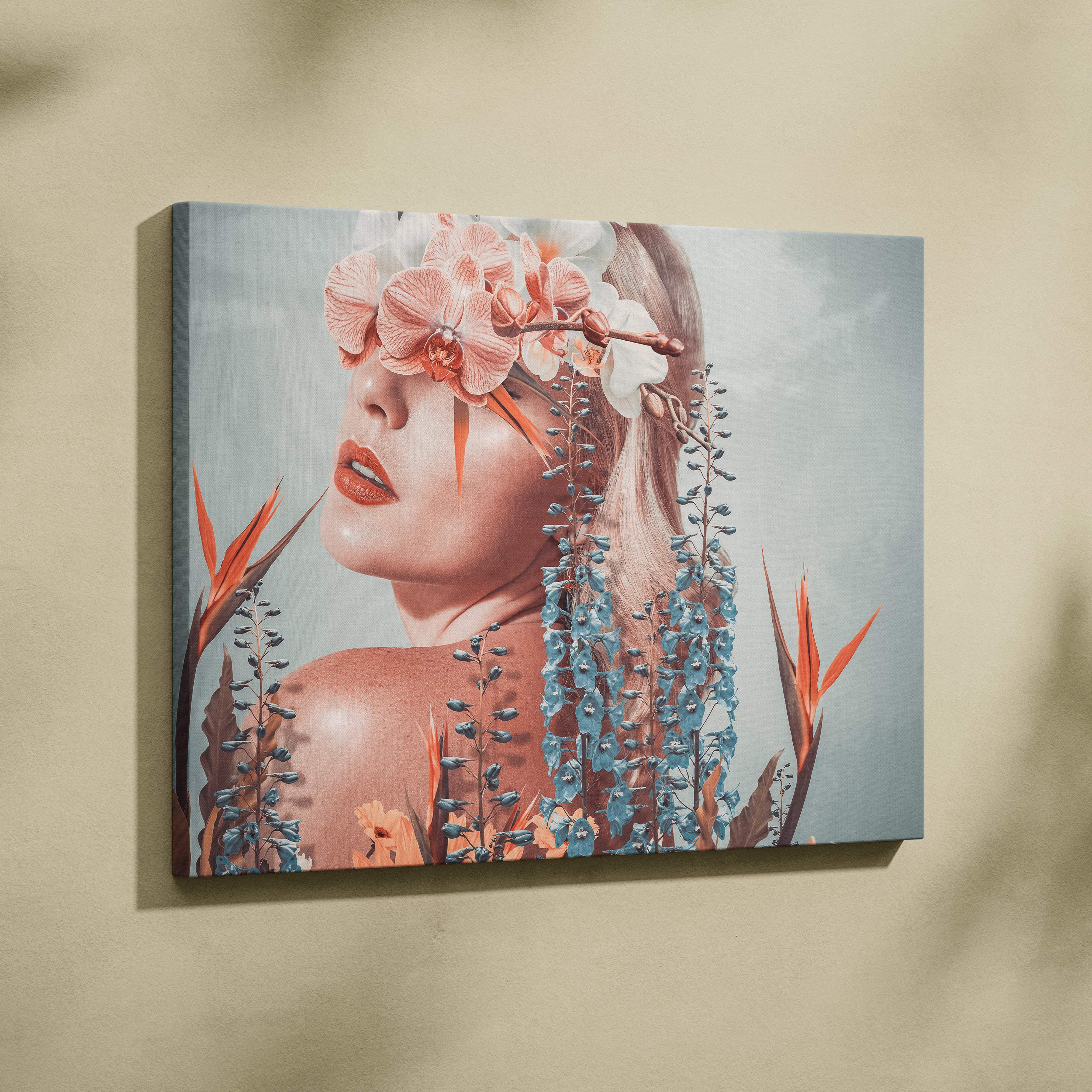 Contemporary floral woman canvas wall art featuring a woman with pink and white orchids and coral blue tropical flowers