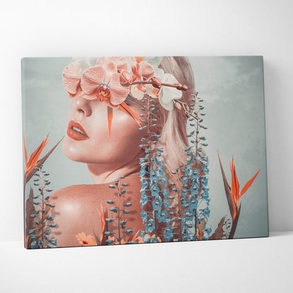 Contemporary floral woman canvas wall art featuring a pink orchid face and tropical orange and blue flowers in coral blue tones
