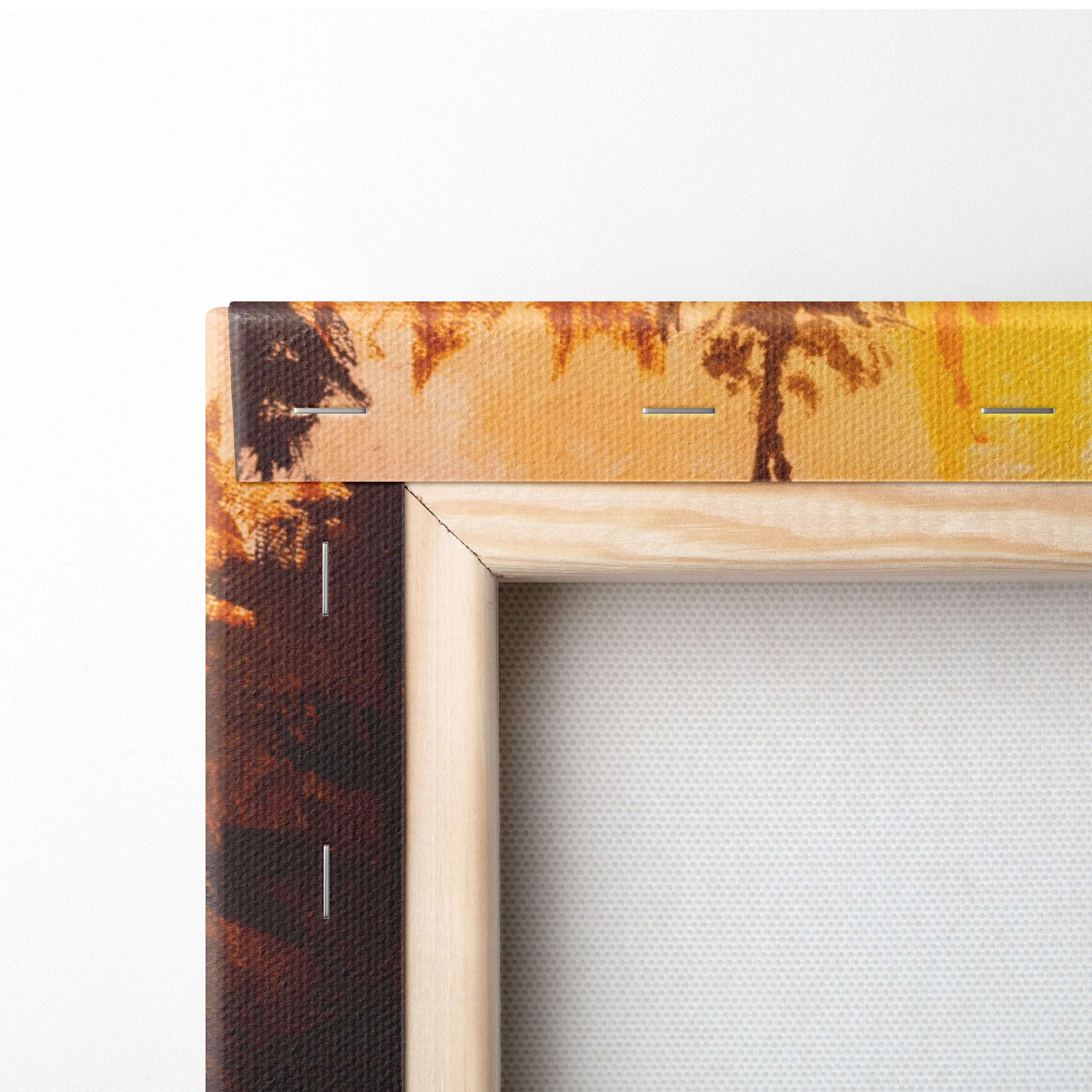 Light wood-framed canvas print of a warm-toned palm tree scene with golden and brown hues in oil painting style