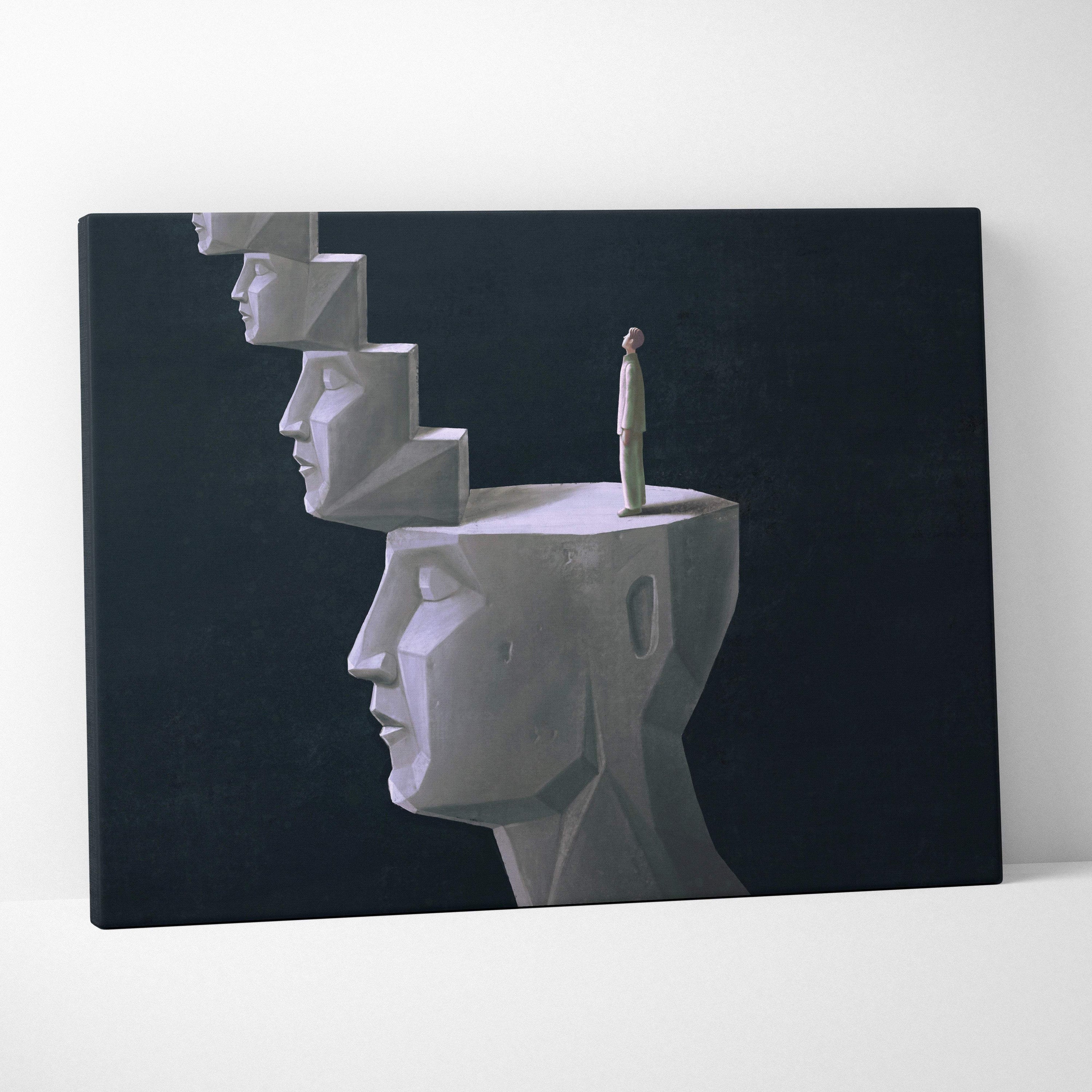 A minimalist canvas print of stacked white geometric stone faces with a small human figure for modern office decor