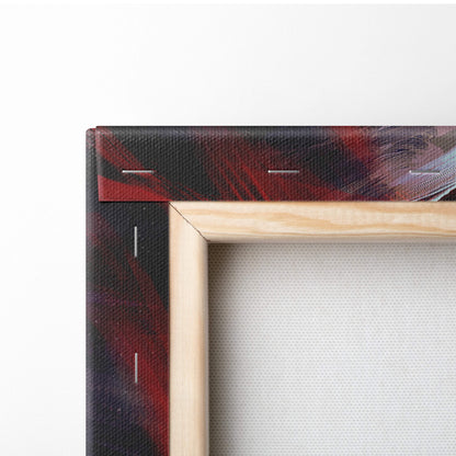 Light-colored wooden frame holding a dark angel warrior canvas art with red and black abstract brushstrokes