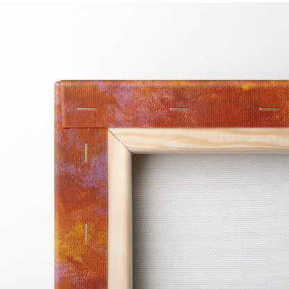 Fiery sunset flower field canvas print featuring a warm orange and purple gradient in a light wooden frame