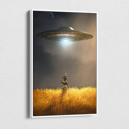 A framed canvas artwork of a dark metallic ufo over golden wheat fields with an astronaut under a dramatic sky
