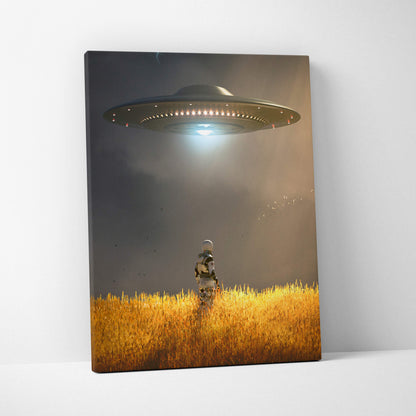 Ufo abduction scene canvas art of a sleek dark gray spaceship with red and white lights over a golden field with astronaut