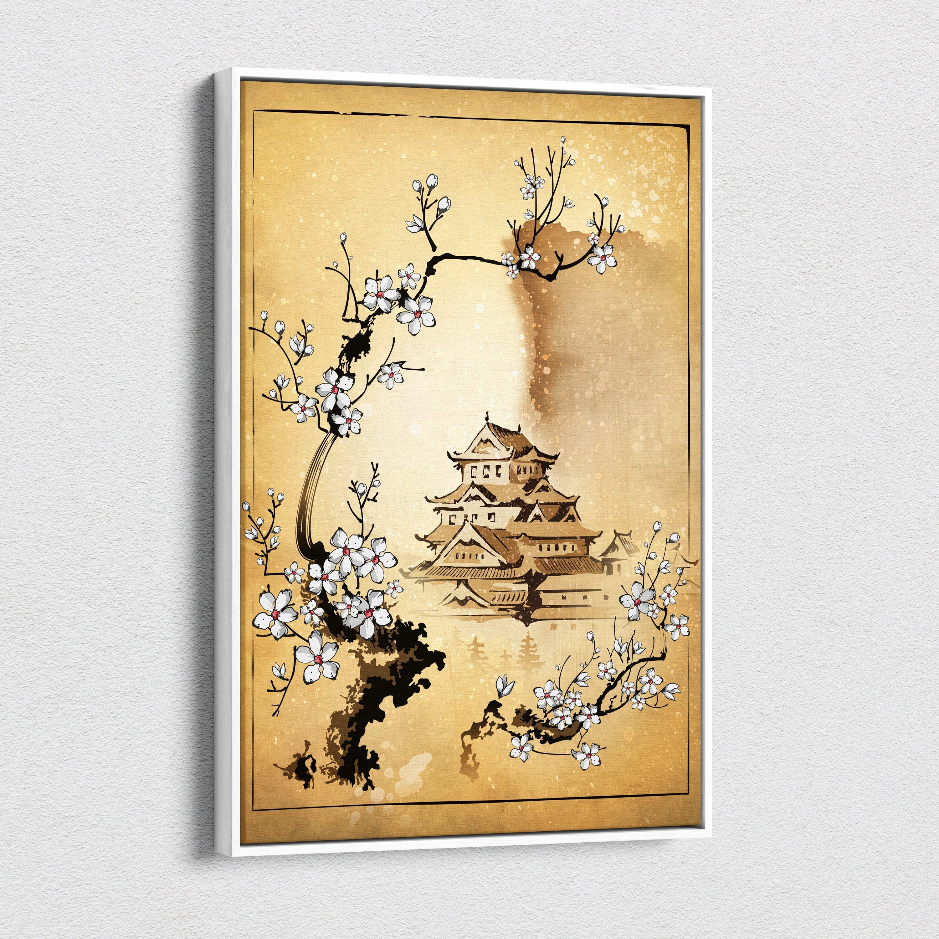 A framed canvas wall art featuring a traditional japanese castle with white cherry blossoms on a gold background