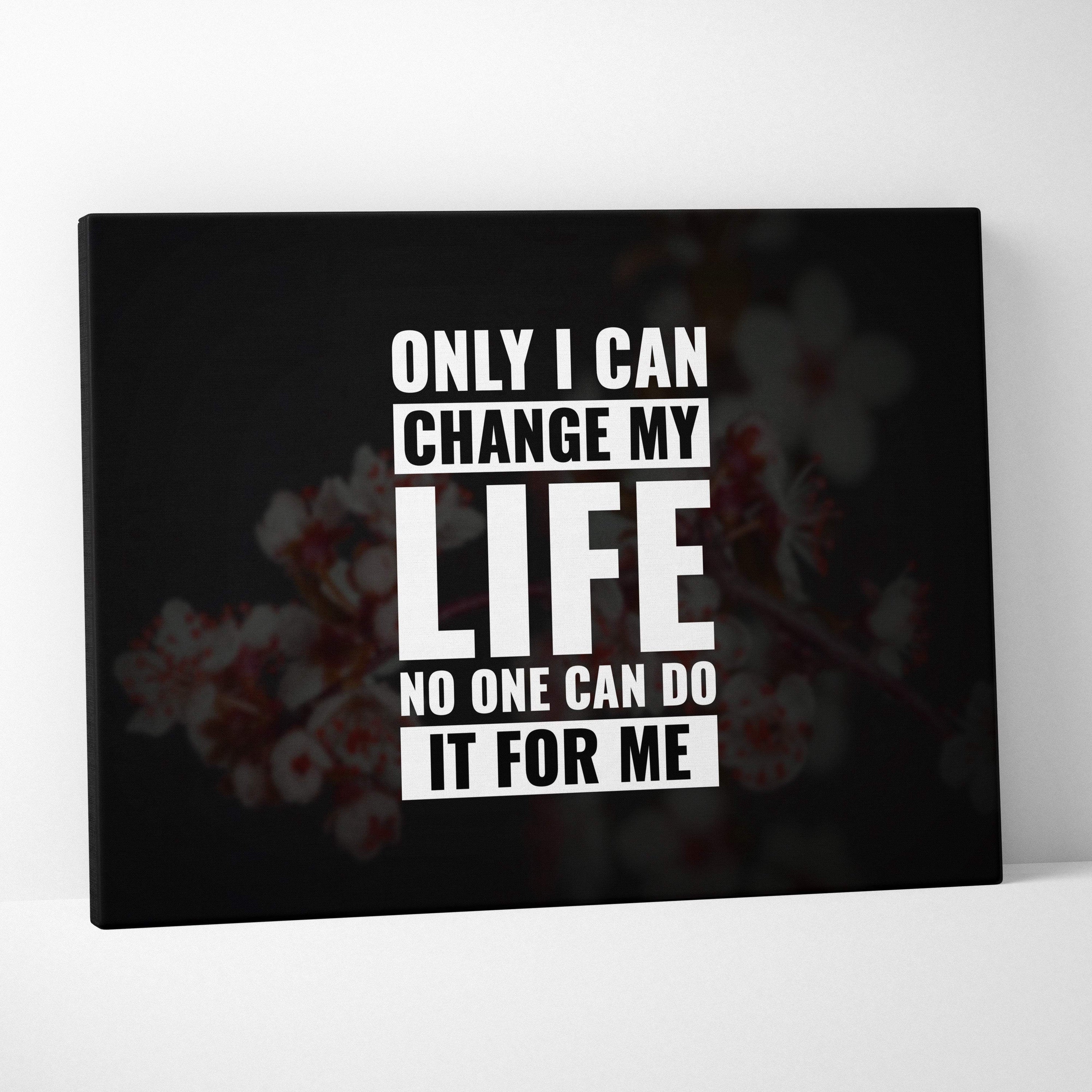 Black canvas print with bold white motivational text on blurred floral background for bedroom office or living room decor