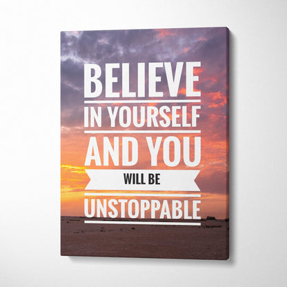 Motivational canvas print with believe in yourself quote over vibrant orange pink and purple sunset sky for office decor