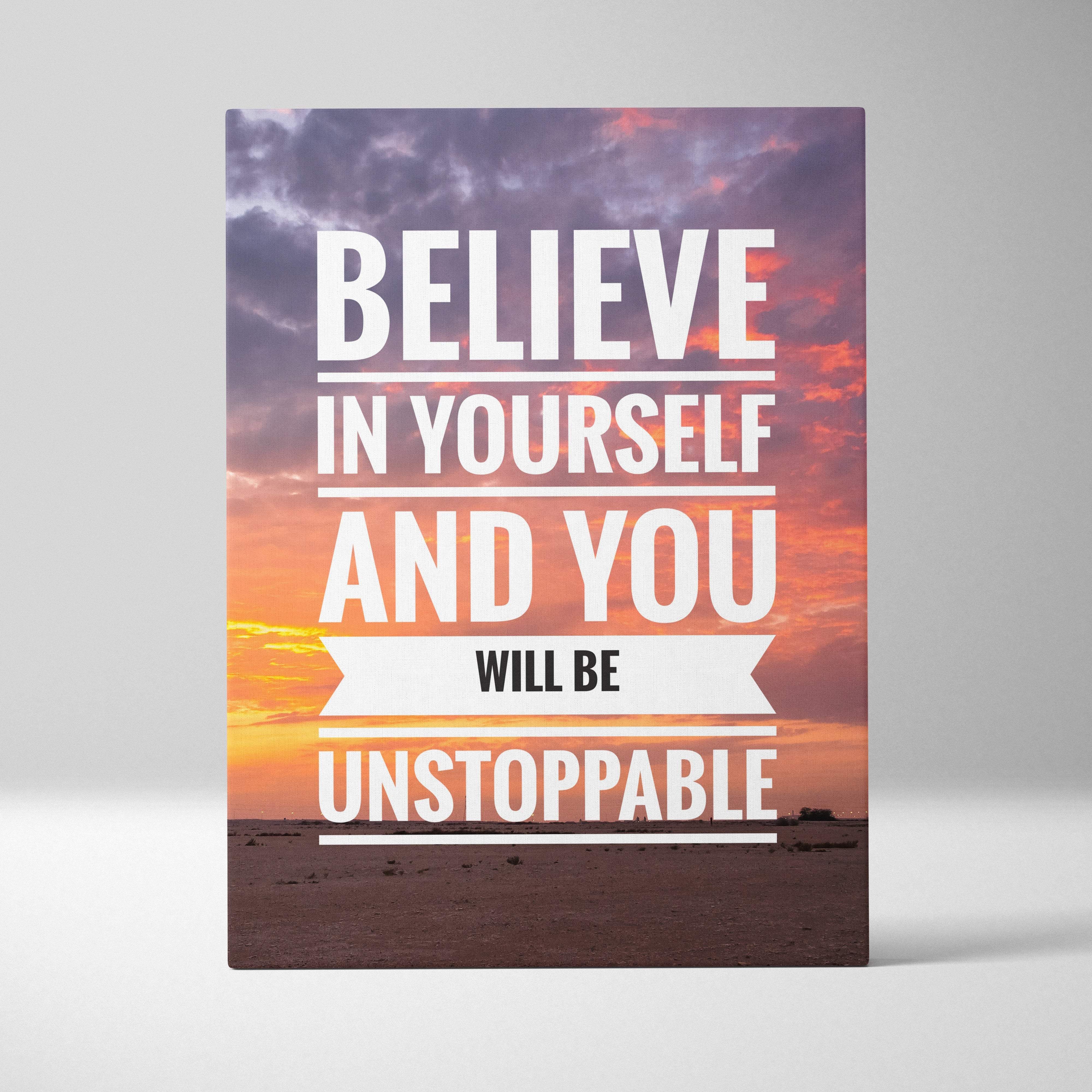 A rectangular canvas print with a motivational believe in yourself quote in white on a vibrant sunset sky background