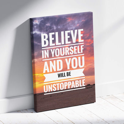 Motivational canvas print with believe in yourself and you will be unstoppable quote on vibrant sunset sky background